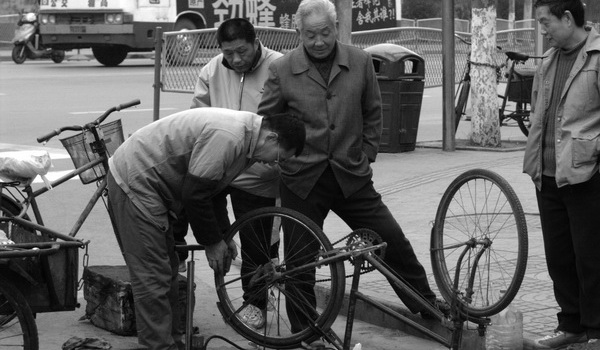 Bike_repair_in_the_street.jpg